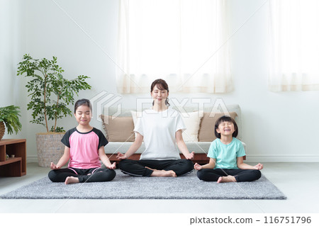 Parents and children exercising in the living room Parents and children exercising in the living room 116751796