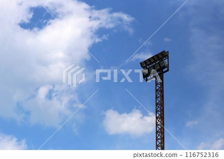 Big light pole on the blue sky background. 116752316