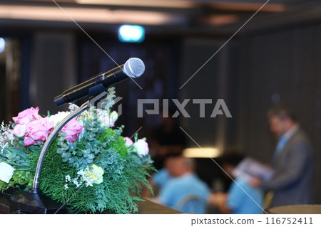Microphone for speakers at the podium on blurred background. Microphone for speakers at the podium on blurred background. 116752411