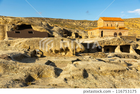 Ancient cave city of Uplistsikhe with active basilica, Georgia 116753175
