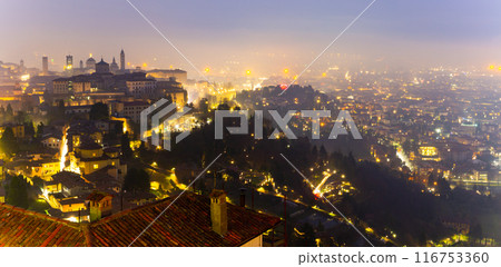 Evening drone view of residential areas of the city of Bergamo 116753360