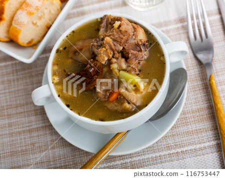Rustic style pearl barley mushroom soup with pork and vegetables 116753447