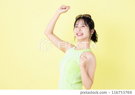 Summer image, yellow background, portrait of a young woman wearing a tank top Summer image, yellow background, portrait of a young woman wearing a tank top 116753769
