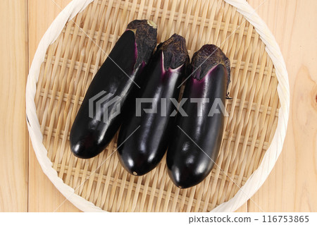 Fresh eggplant in a colander 116753865