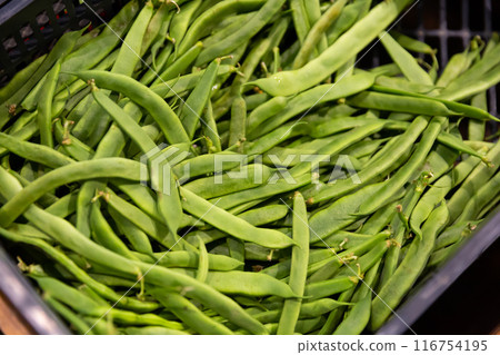 Raw green beans in greengrocery store 116754195