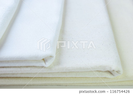 stack of white cotton clothes, textile fashion industry 116754426
