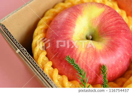 beautiful apple in the box on pink background, healthy fruit beautiful apple in the box on pink background, healthy fruit 116754437