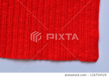 red wool knitted yarn texture, woolen fabric on white background red wool knitted yarn texture, woolen fabric on white background 116754529