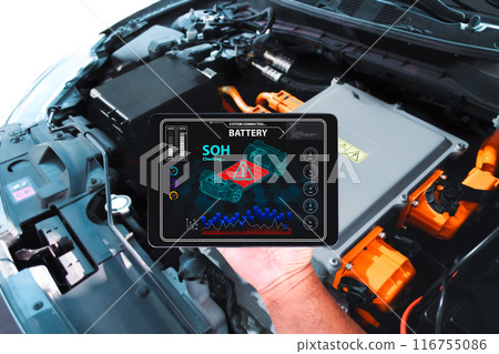 Car technician is checking SOH state of health of battery with a wireless scanner tools Car technician is checking SOH state of health of battery with a wireless scanner tools 116755086