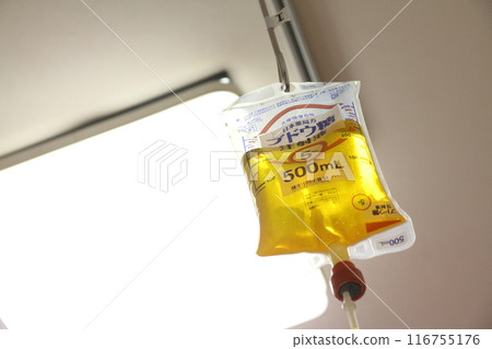 Image of hospitalization or feeling unwell receiving an IV in a hospital room Image of hospitalization or feeling unwell receiving an IV in a hospital room 116755176