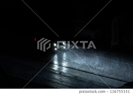 A car driving on a road with poor visibility during a heavy rainy night a-1 A car driving on a road with poor visibility during a heavy rainy night a-1 116755331