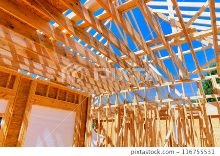 New home that is under construction with timber truss frame has roof joints New home that is under construction with timber truss frame has roof joints 116755531