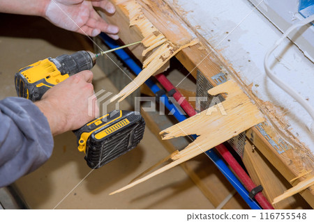 When repairing house, plywood floors that have been damaged are replaced When repairing house, plywood floors that have been damaged are replaced 116755548