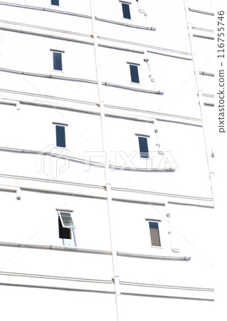 Windows of an apartment building on a white wall background. Windows of an apartment building on a white wall background. 116755746