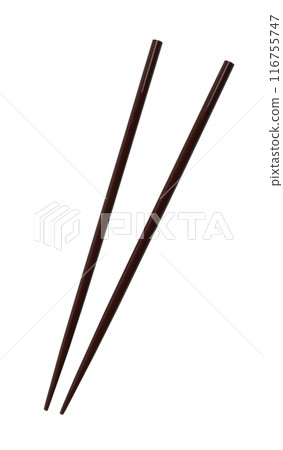 Wooden chopsticks are used as eating utensils. Wooden chopsticks are used as eating utensils. 116755747