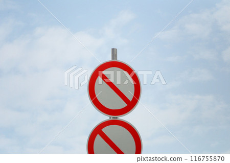 Warning sign on blue sky background. Warning sign on blue sky background. 116755870