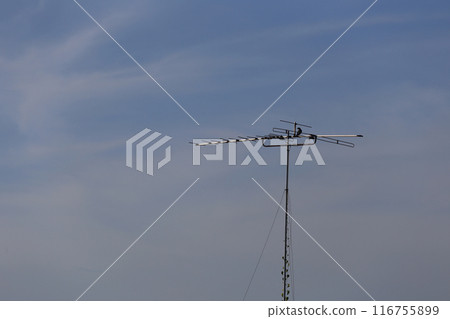 Antique television antenna set outdoors. 116755899