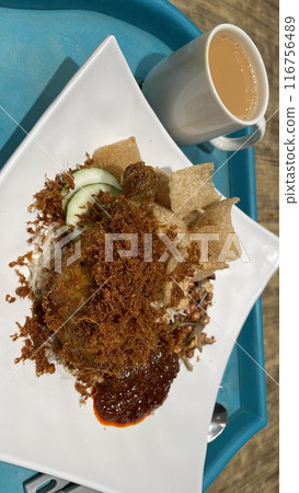 Nasi Lemak with fried chicken, small fish and chili 116756489
