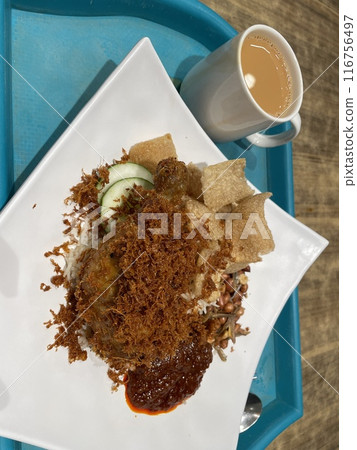 Nasi Lemak with fried chicken, small fish and chili 116756497