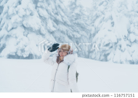 Woman tourist sightseeing Snow monster in Winter day at Mount Zao, Yamagata prefecture, Japan. Happy Traveler walking on powder snow covered in frosty weather. Travel, Adventure and Vacation Woman tourist sightseeing Snow monster in Winter day at Mount Zao, Yamagata prefecture, Japan. Happy Traveler walking on powder snow covered in frosty weather. Travel, Adventure and Vacation 116757151