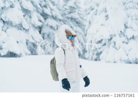 Woman tourist sightseeing Snow monster in Winter day at Mount Zao, Yamagata prefecture, Japan. Happy Traveler walking on powder snow covered in frosty weather. Travel, Adventure and Vacation 116757161