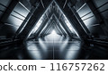 A large, empty, and dark room with a white light shining through the ceiling 116757262