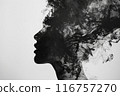 A woman's face is obscured by smoke, creating a sense of mystery and intrigue 116757270