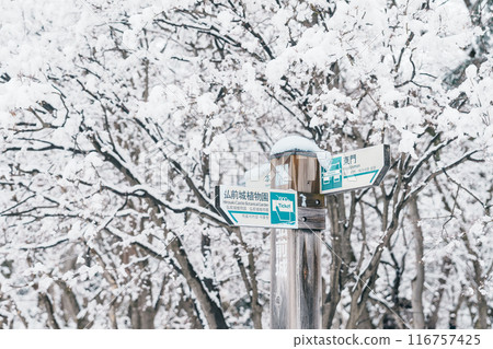 Hirosaki Castle direction sign or Takaoka Castle entrance with snow in winter, Japanese castle located in Hirosaki city, Aomori Prefecture, Tohoku, Japan. Landmark for tourist attraction. Japan travel 116757425