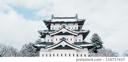 White Hirosaki Castle or Takaoka Castle with snow in winter, hirayama style Japanese castle located in Hirosaki city, Aomori Prefecture, Tohoku, Japan. Landmark for tourist attraction. Japan travel 116757437