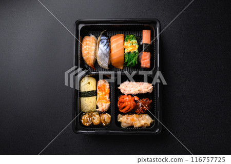 Nigiri sushi and Gunkan maki sushi set in lunch box, Japanese food, Top view Nigiri sushi and Gunkan maki sushi set in lunch box, Japanese food, Top view 116757725