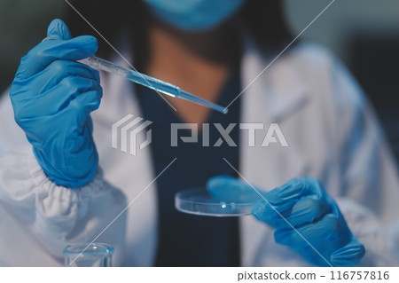 Group of dedicated scientist conduct chemical experiment in medical laboratory, carefully drop precise amount of liquid from pipette into test tube for vaccine drug or antibiotic development. Neoteric Group of dedicated scientist conduct chemical experiment in medical laboratory, carefully drop precise amount of liquid from pipette into test tube for vaccine drug or antibiotic development. Neoteric 116757816