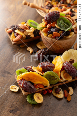 Dried tropical fruits with various nuts and raisins. 116757931