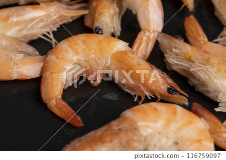 semi-finished product of heavily frozen red shrimps semi-finished product of heavily frozen red shrimps 116759097