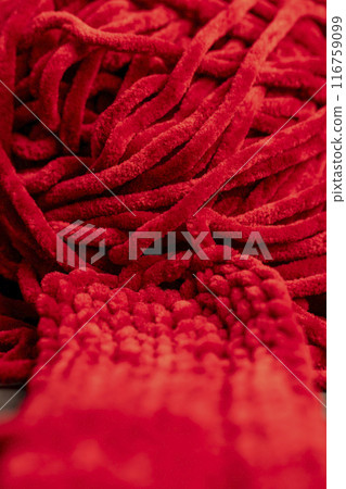 new soft red threads with traces of other threads in close-up 116759099