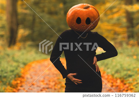 pregnant woman with pumpkin head halloween costume 116759362