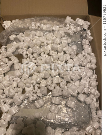 Unboxing package with lots of packing peanuts Unboxing package with lots of packing peanuts 116759623