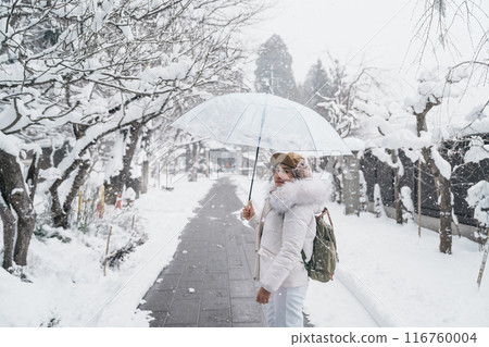 Woman tourist sightseeing Yamadera temple with snow in winter, traveler travel Risshakuji temple in Yamagata City, in Yamagata Prefecture, Tohuku, Japan. Landmark for tourists attraction in Japan 116760004