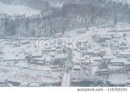 view of village with snow in winter from mountain viewpoint of Yamadera temple, the popular name for the Buddhist temple of Risshakuji located in Yamagata City, in Yamagata Prefecture, Tohuku, Japan 116760204