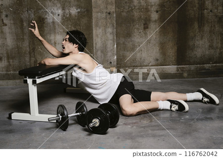 young man training in the gym young man training in the gym 116762042