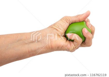 Female hand squeezing stress ball on white background 116762119