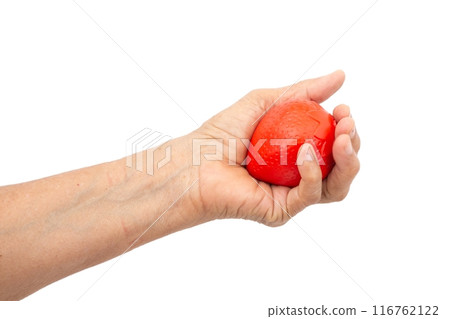 Female hand squeezing stress ball on white background 116762122