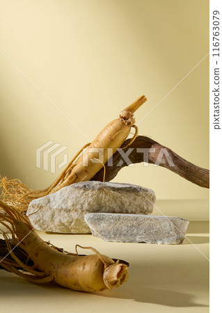 Ginseng extract products advertising photo was shot from frontal over yellow background, in the center having an empty stone podium for product showing. Blank space for adding text Ginseng extract products advertising photo was shot from frontal over yellow background, in the center having an empty stone podium for product showing. Blank space for adding text 116763079