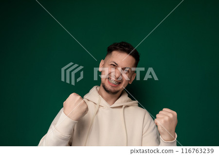 Man in White Hoodie Giving Thumbs Up Man in White Hoodie Giving Thumbs Up 116763239