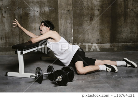 young man training in the gym 116764121