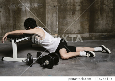 young man training in the gym young man training in the gym 116764123