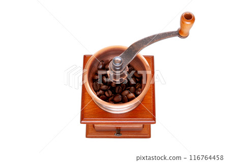 Image of grinding coffee beans with a coffee mill Image of grinding coffee beans with a coffee mill 116764458