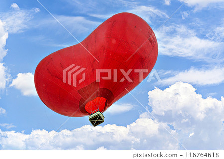 ReRed heart-shaped hot air balloon flying over a blue sky with white cloudsd heart-shaped hot air balloon flying over a blue sky with white clouds ReRed heart-shaped hot air balloon flying over a blue sky with white cloudsd heart-shaped hot air balloon flying over a blue sky with white clouds 116764618
