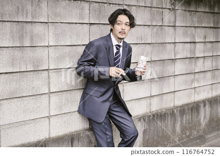 Man smoking outdoors 116764752