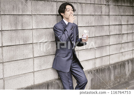 Man smoking outdoors 116764753