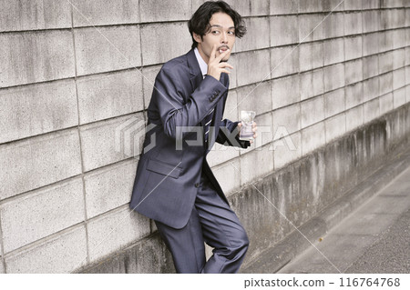 Man smoking outdoors Man smoking outdoors 116764768